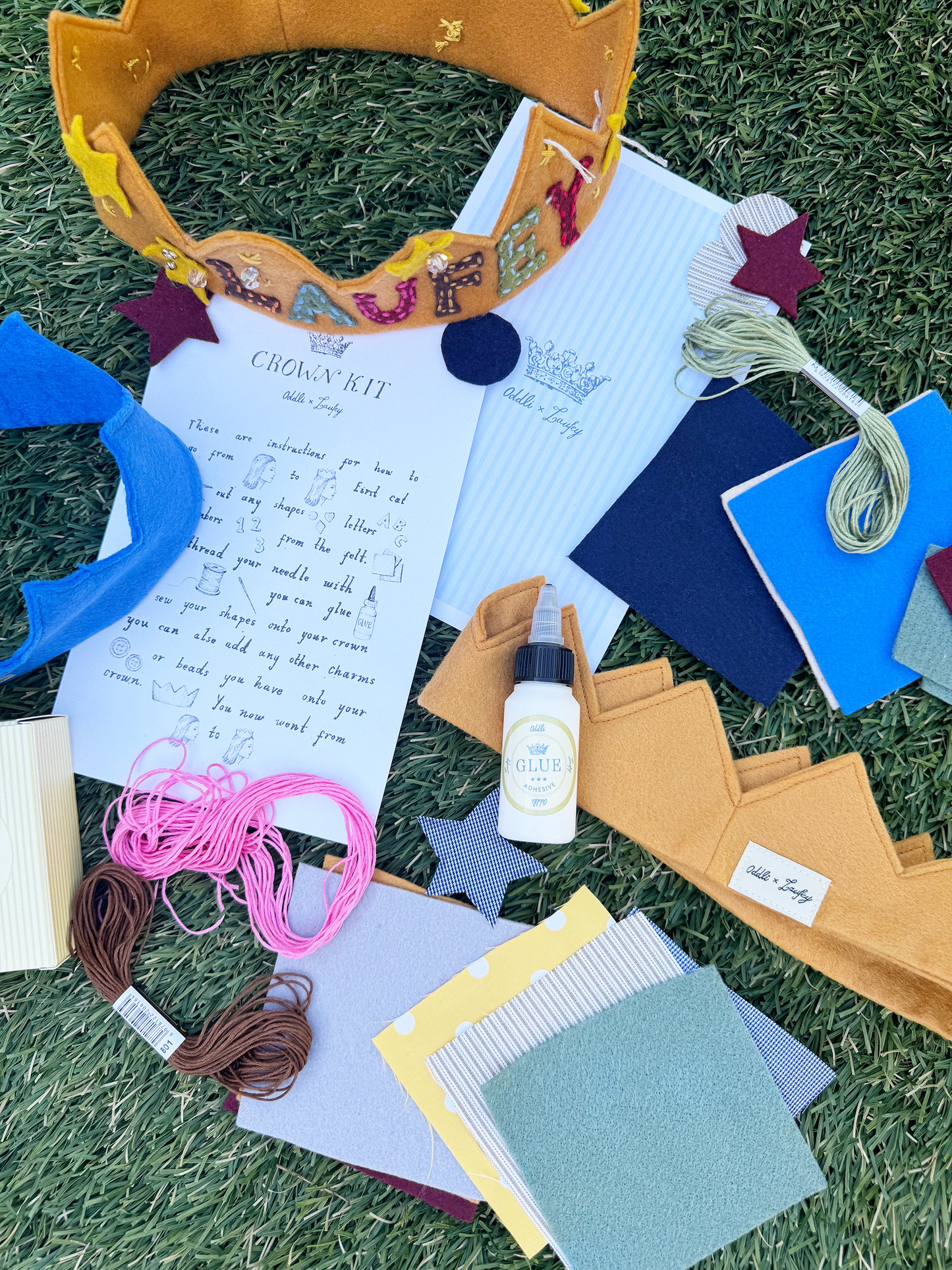 Crafting materials and supplies on a grassy surface