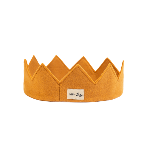 Mustard yellow crown with a label on a white background