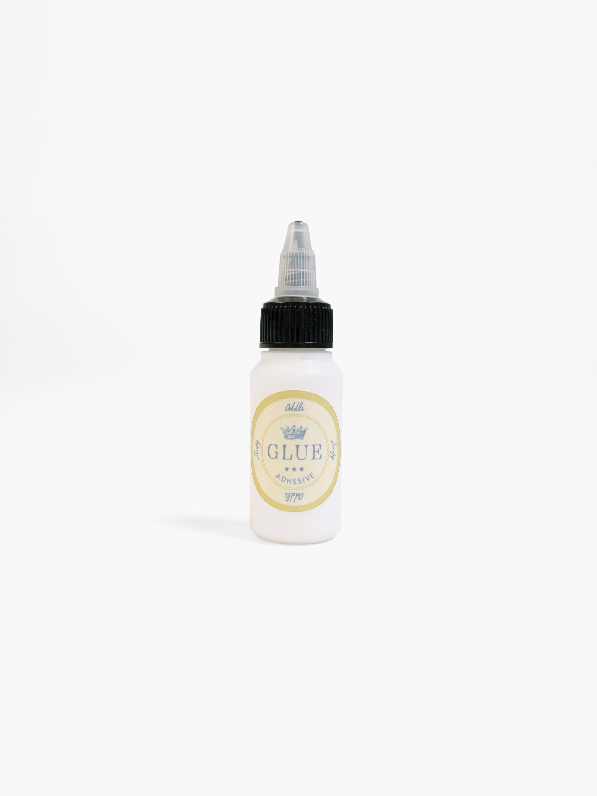 Bottle of glue with a label on a white background