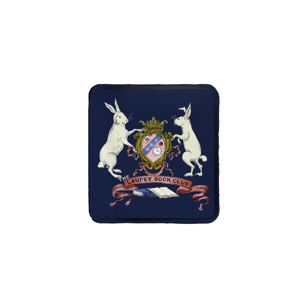 A woven patch featuring a coat of arms with rabbits and text, predominantly blue.