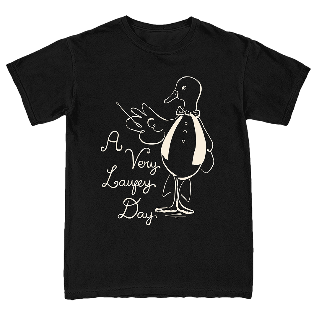 A black short-sleeve crewneck t-shirt featuring a white line art graphic of a duck in a tuxedo next to the text 'A Very Lafezy Day' in a cursive font.