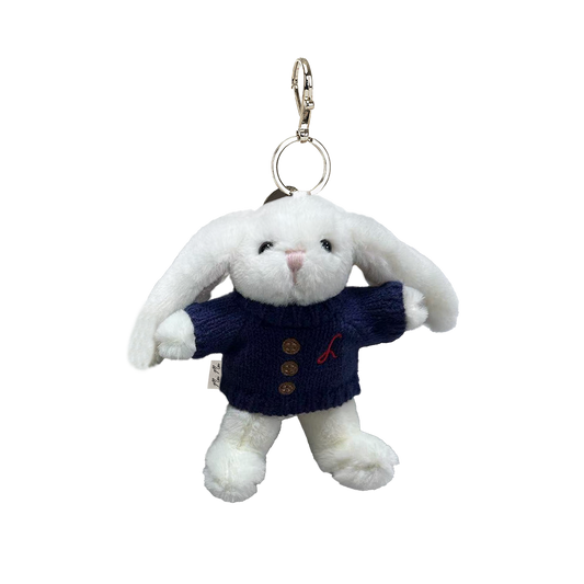 White plush bunny keychain with a navy sweater on a white background