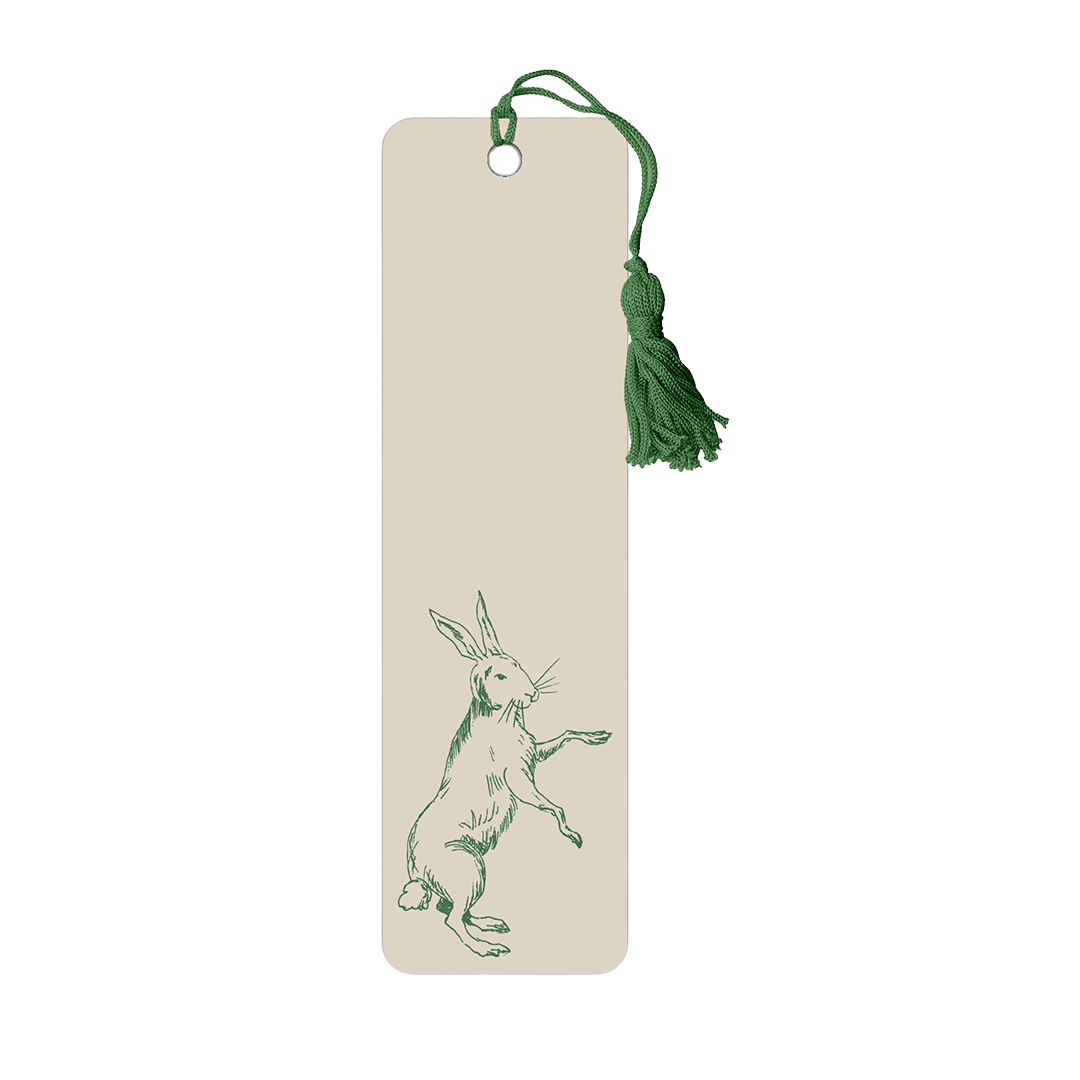 Bookmark with a green rabbit illustration and tassel on a beige background