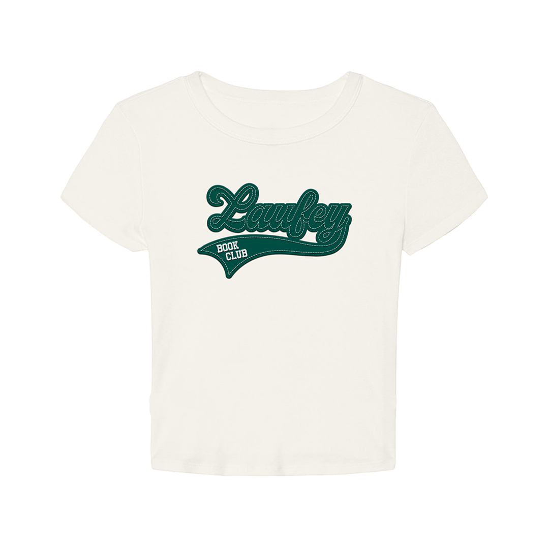 An off-white short-sleeve crop top featuring a dark green retro-style 'Laufey Book Club' graphic on the chest, displayed against a solid white background.