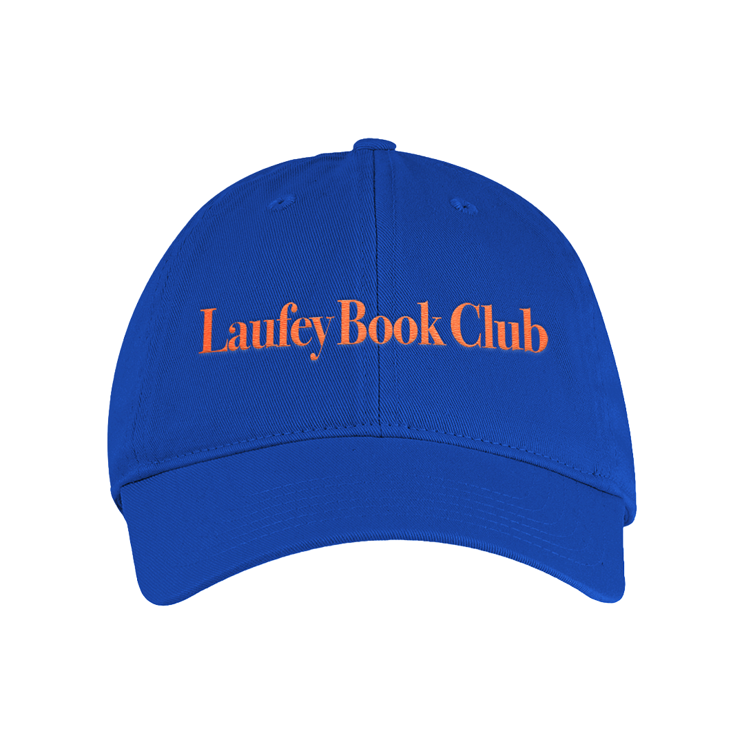 A royal blue baseball cap with 'Laufey Book Club' embroidered in orange across the front, shown against a plain white background.