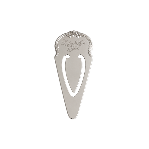A silver metal pocket knife sheath with an ornate top handle and a cutout center, featuring the engraved brand name 'Raspberry Bay Club' on a plain white background.