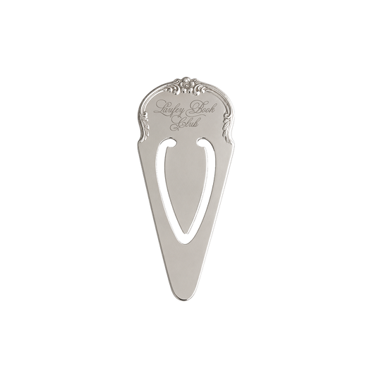 A silver metal pocket knife sheath with an ornate top handle and a cutout center, featuring the engraved brand name 'Raspberry Bay Club' on a plain white background.