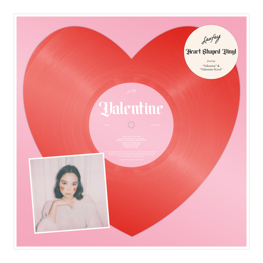A heart-shaped, red 7" vinyl record labeled 'Valentine' with a picture of a woman in a inset square on the front cover.